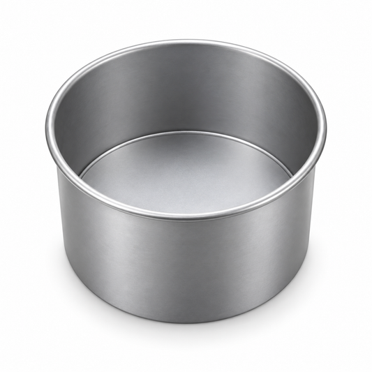 Molde redondo de aluminio con fondo desmontable de 10 cm de diámetro y 7 cm de alto sobre fondo blanco